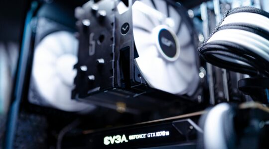 Detailed view of a cooling fan inside a modern gaming PC setup.